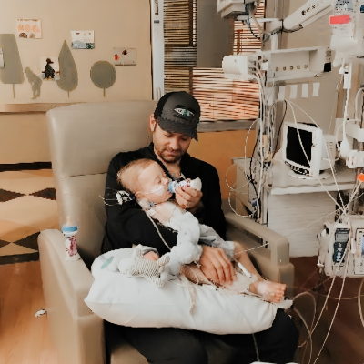 Ryan taking care of his son Bennett at the hospital.